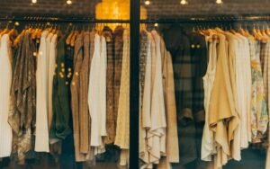 Rail of clothes in neutral beige, brown and cream tones