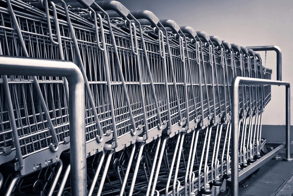 Rows of empty metal shopping carts lined up